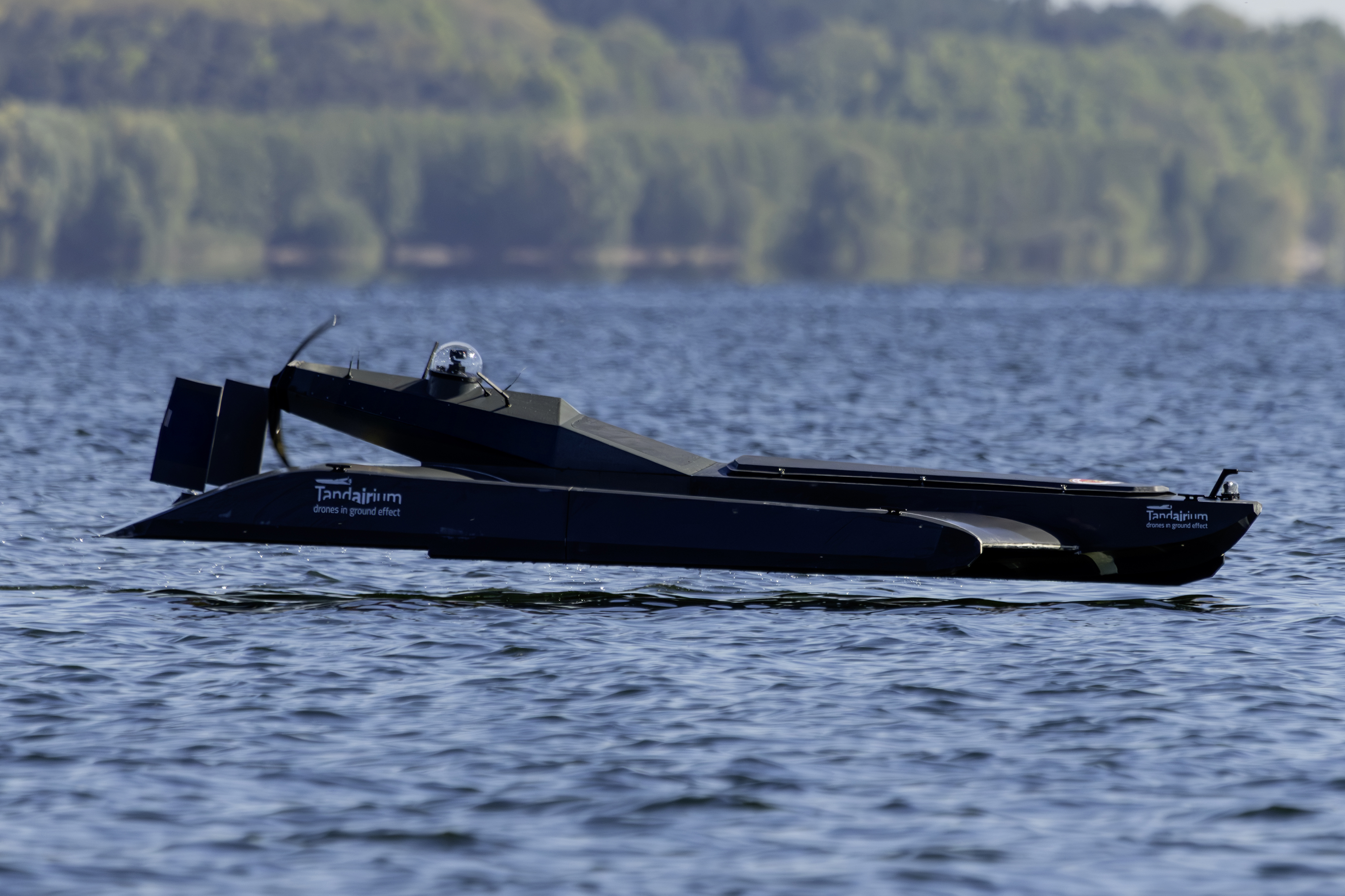 TW4 Cargo unmanned ground effect drone by Tandairium operating on water – developed in Europe, based on the self-stabilizing tandem wing principle. This modular WIG craft combines speed, high payload capacity, and low radar signature for maritime missions in defense, logistics, and research. Efficient, scalable, and eco-friendly – redefining the future of maritime mobility.
